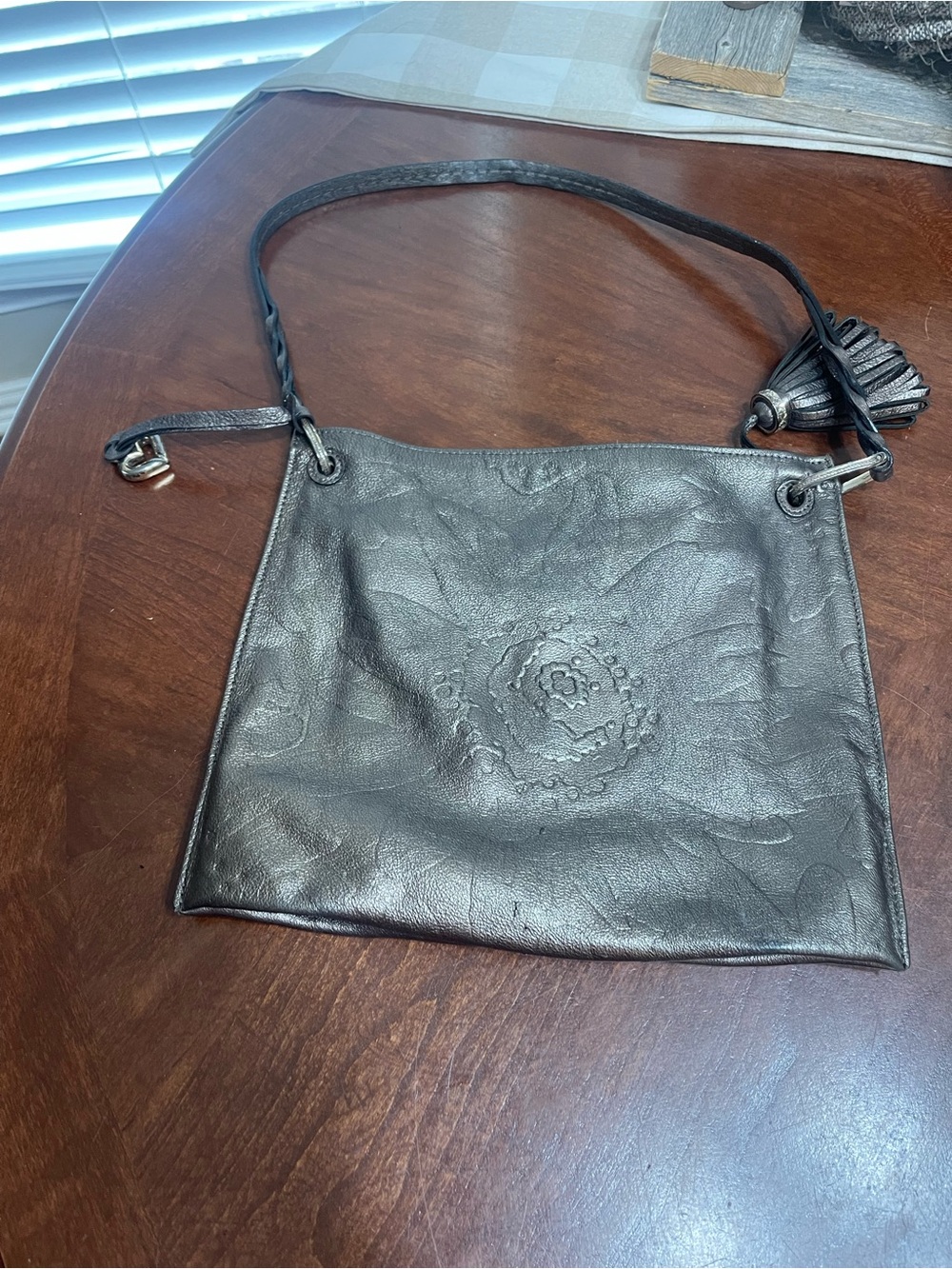 Brighton Embossed Flower Leather Bag tassel read